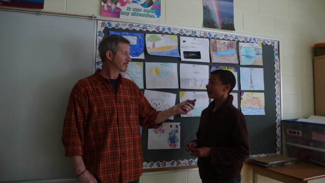 Tim Interviews Peter about his plans to write and article about iPads in school. Photo by Tori